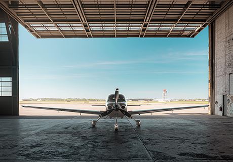 photo of Ron Wright's personal aircraft, parked in the hanger, rear view