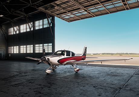photo of Ron Wright's personal aircraft, parked in the hanger, three-quarter view